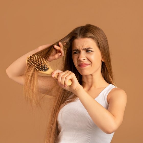 How many hair strands is normal to shed daily?